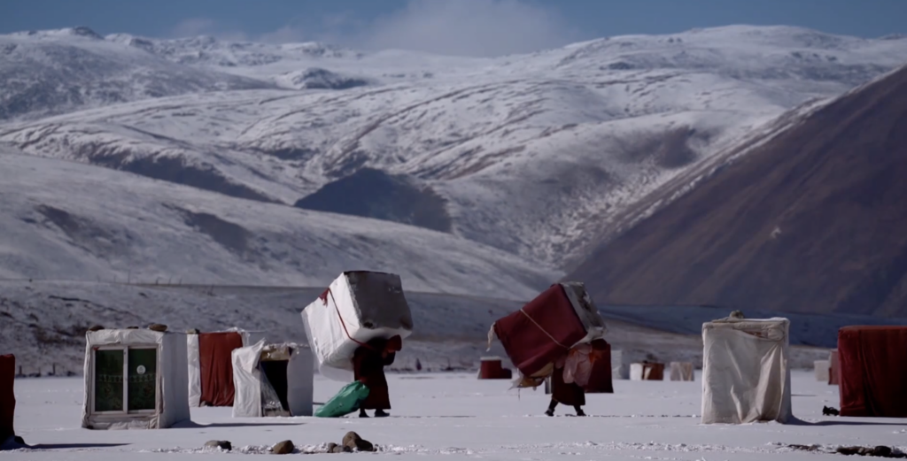 Nuns carrying their meditation boxes at Yarchen monastery 